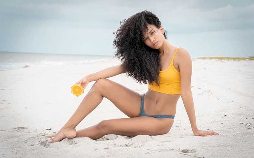 beautiful-dominican-woman-in-yellow-swimming-suit